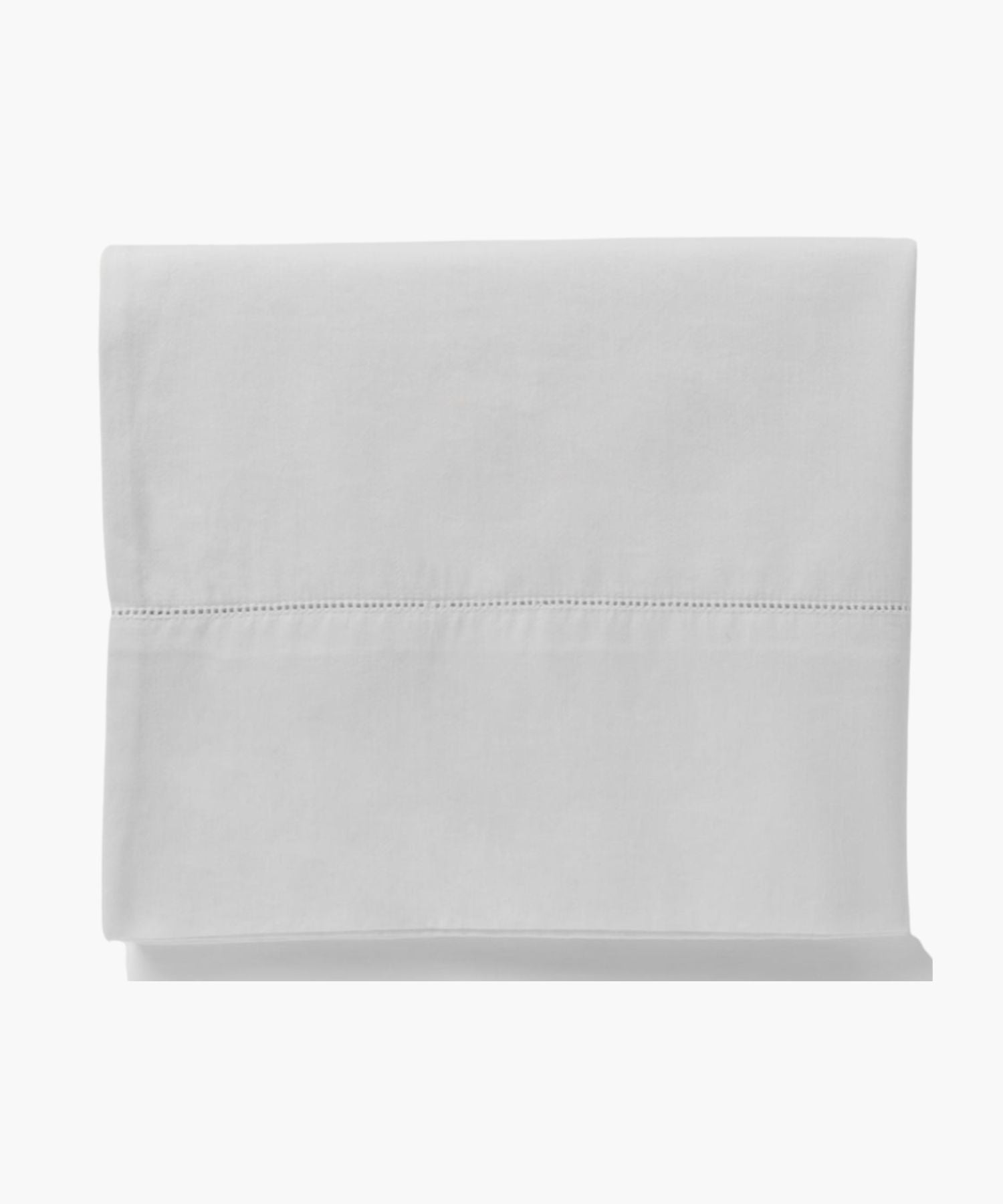 Detail shot of the Murano white flat sheet folded to highlight the elegant hemstitch accent near the edge.