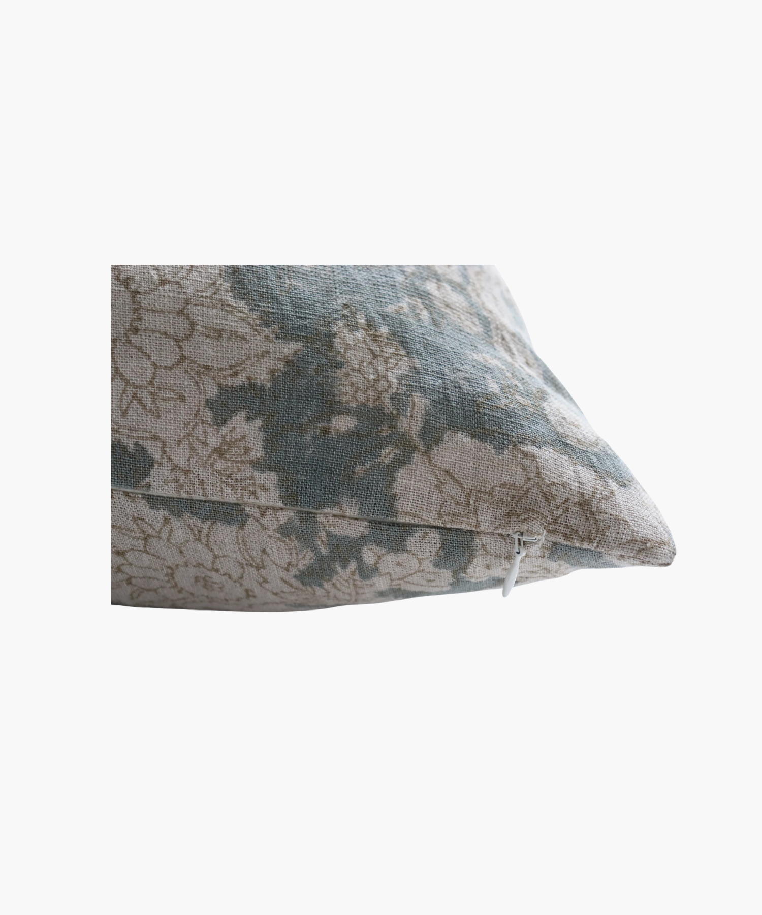 A detailed picture of a square pillow highlighting a vintage floral pattern featuring beige flowers on a muted teal background. The design exudes a calm and classic feel.