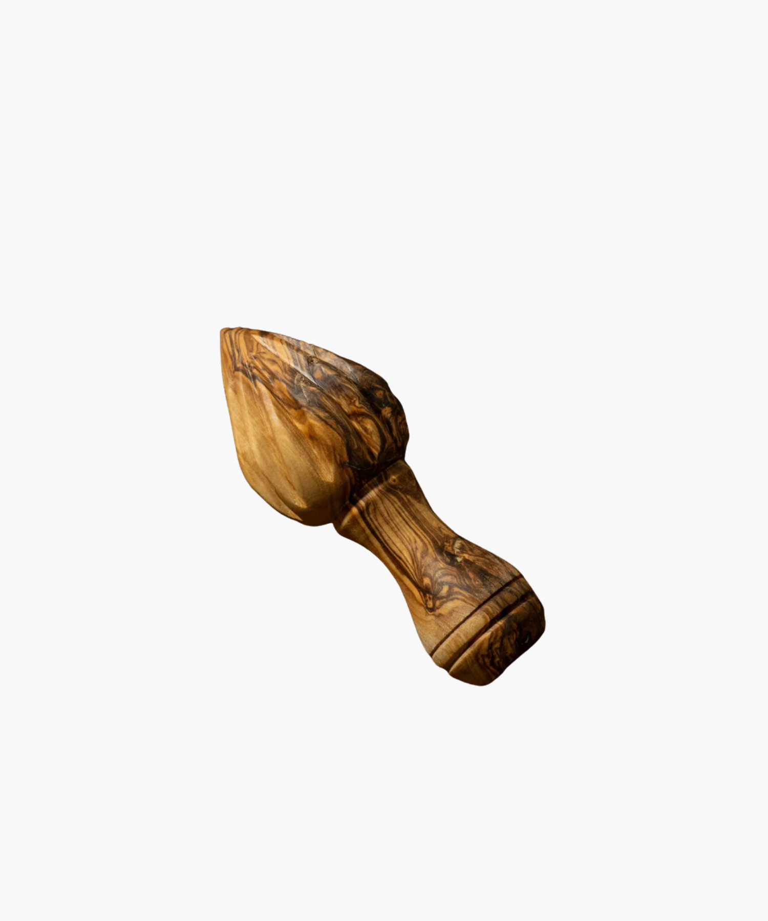 An olive wood lemon press with a textured, dark and light brown marbled pattern, featuring a smooth handle. | Wildwood Home Co.