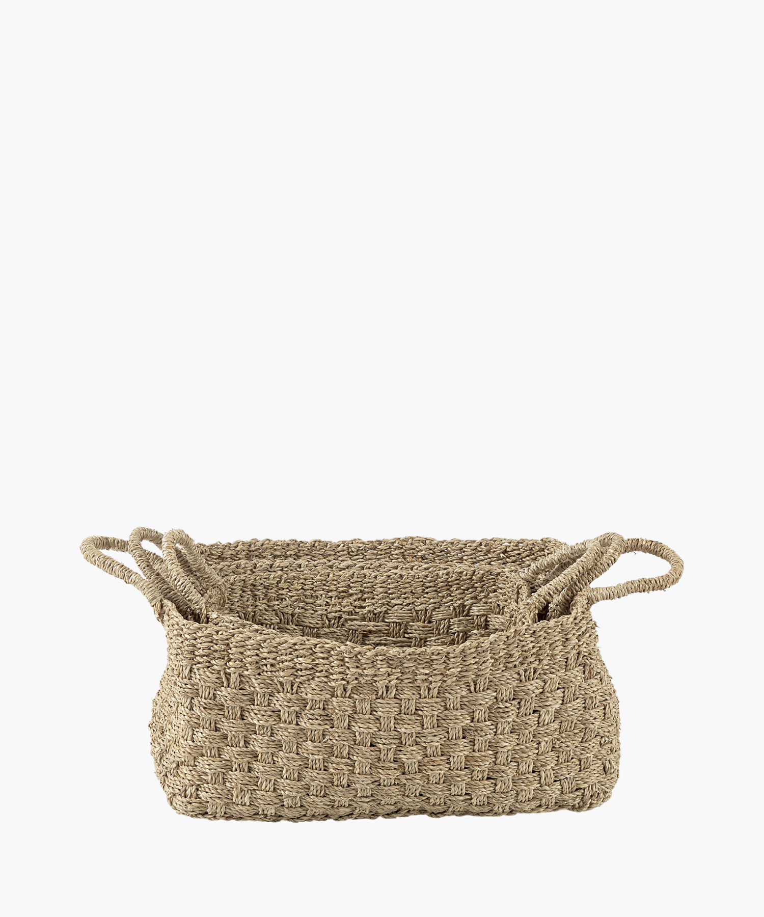 Three rectangular seagrass woven baskets in various sizes with two looped handles, made of natural fibers in a textured, checkerboard pattern. The tone is earthy and rustic. | Wildwood Home Co.