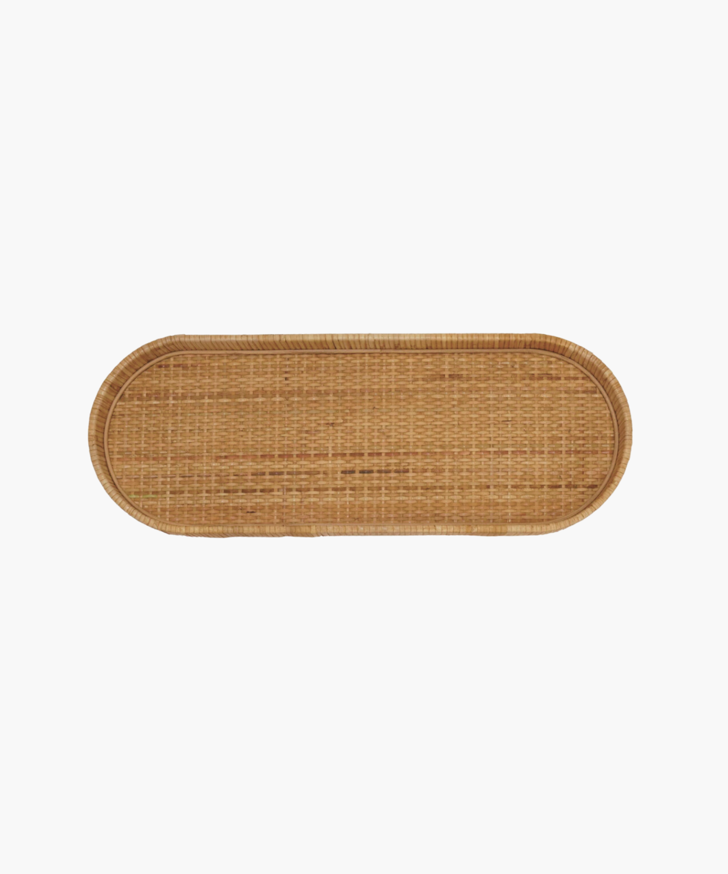 Small oval wicker handwoven tray with rounded edges, against a white background. Natural, rustic texture.
