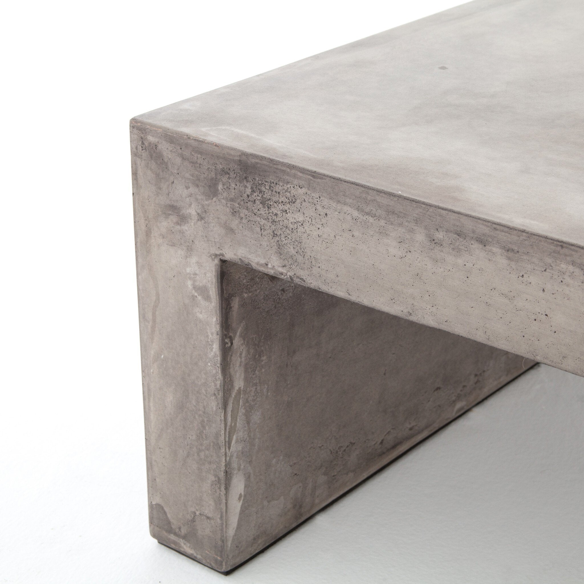 Dark grey concrete waterfall coffee table on a white background. 