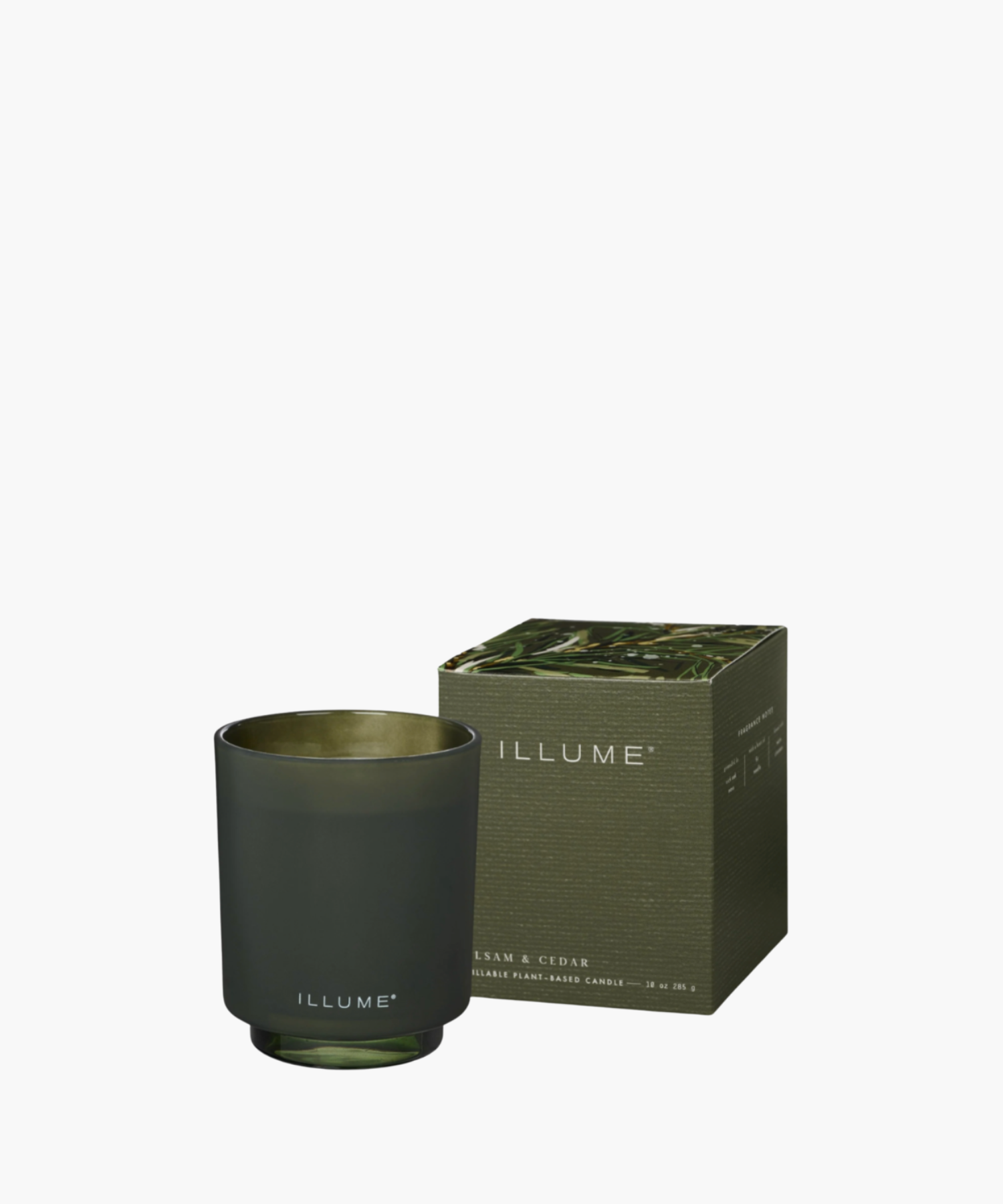 Dark Green frosted glass candle with "ILLUME" branding beside a matching decorated box. Soft, elegant design conveys a sense of calm and sophistication.