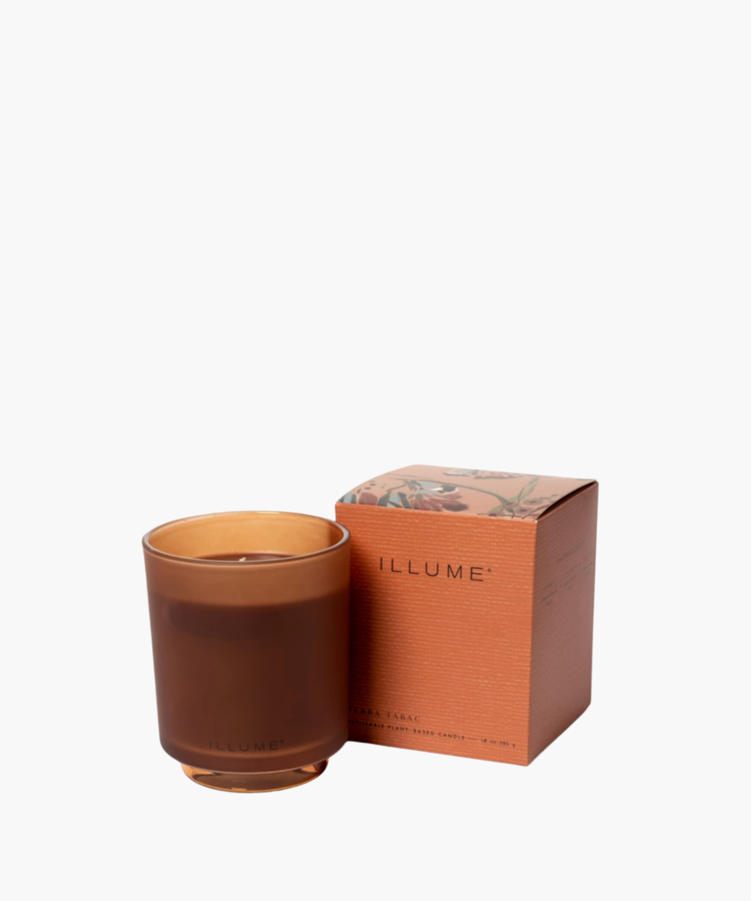 Burnt Orange frosted glass candle with "ILLUME" branding beside a matching decorated box. Soft, elegant design conveys a sense of calm and sophistication.