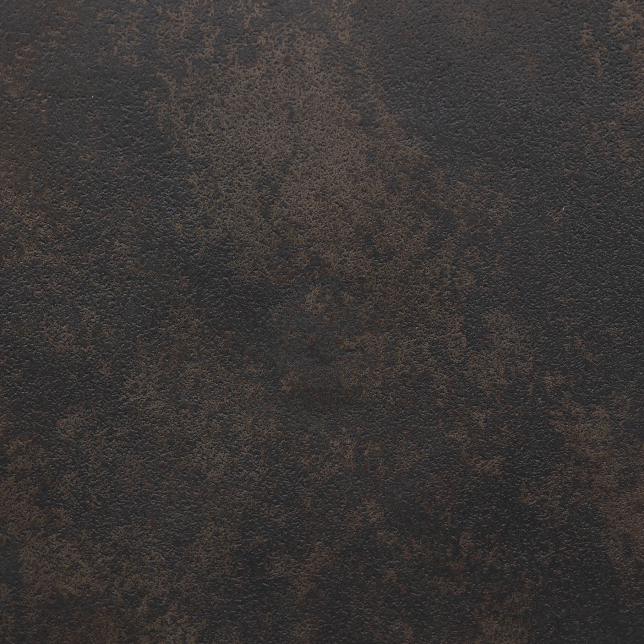 Close up picture the distressed bronze finish showing its color and texture.