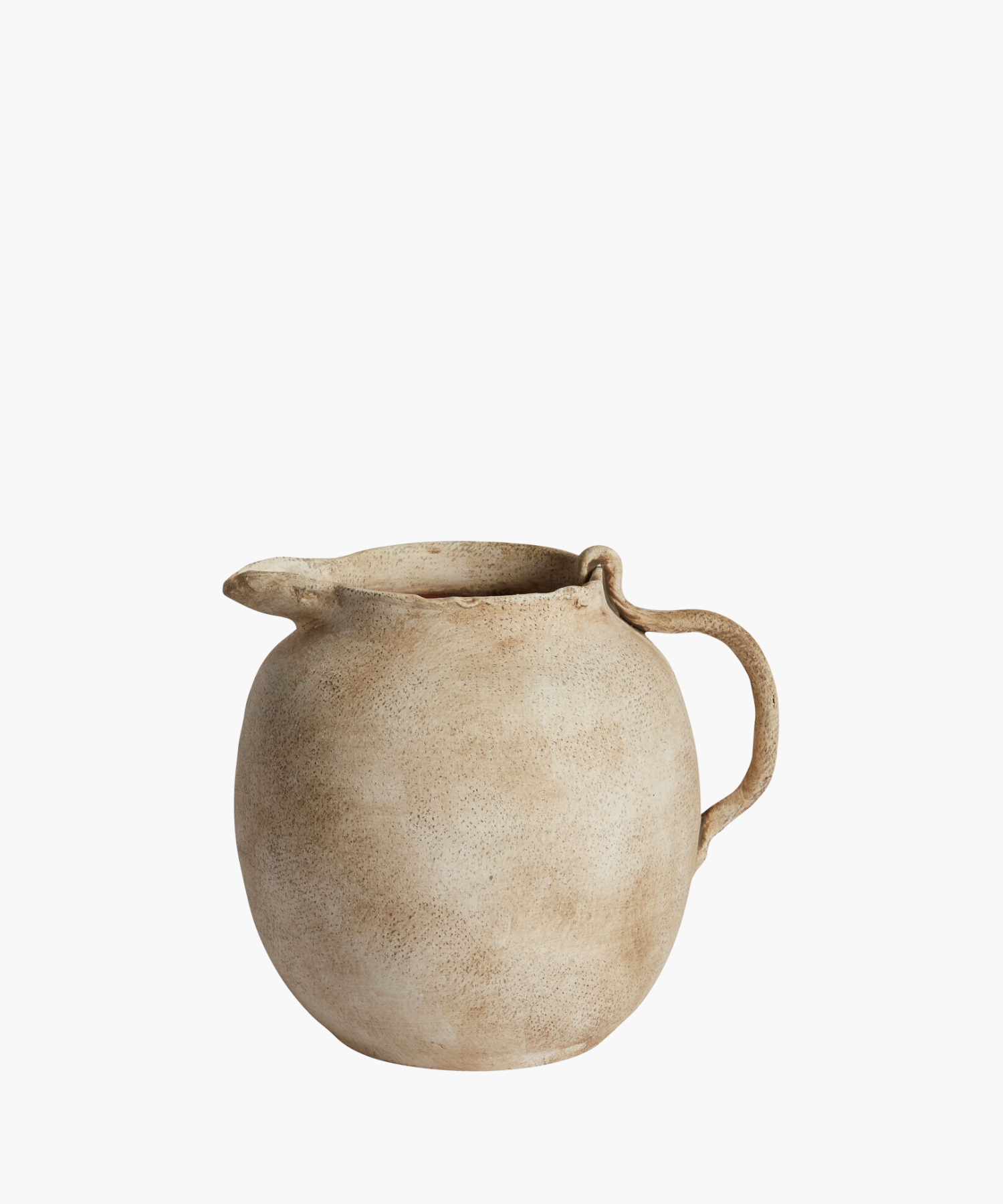 Rustic beige ceramic pitcher with a rounded body, textured surface, and curved handle. The design evokes a vintage, handcrafted feel. | Wildwood Home Co.