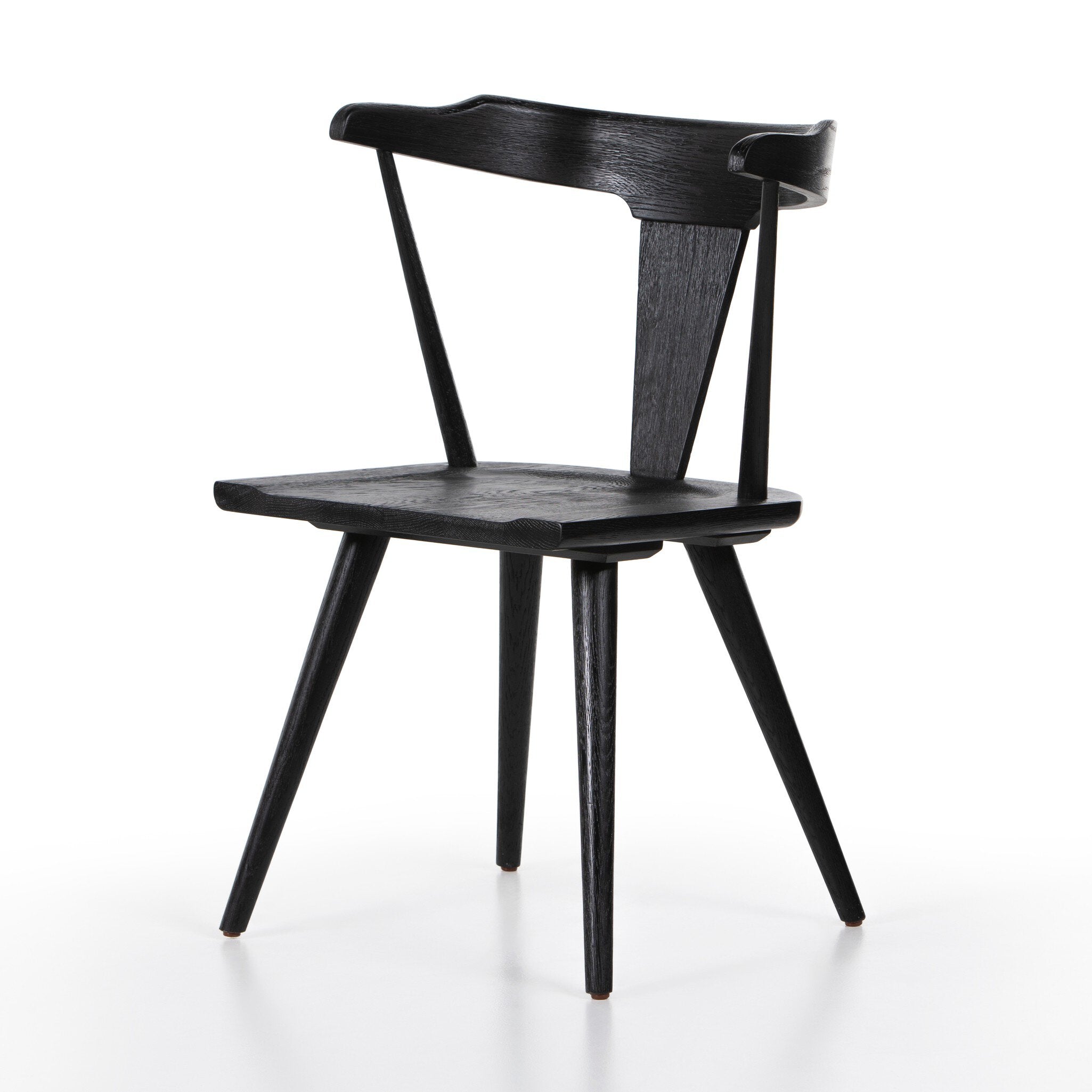 Black wooden dining chair on a white background.