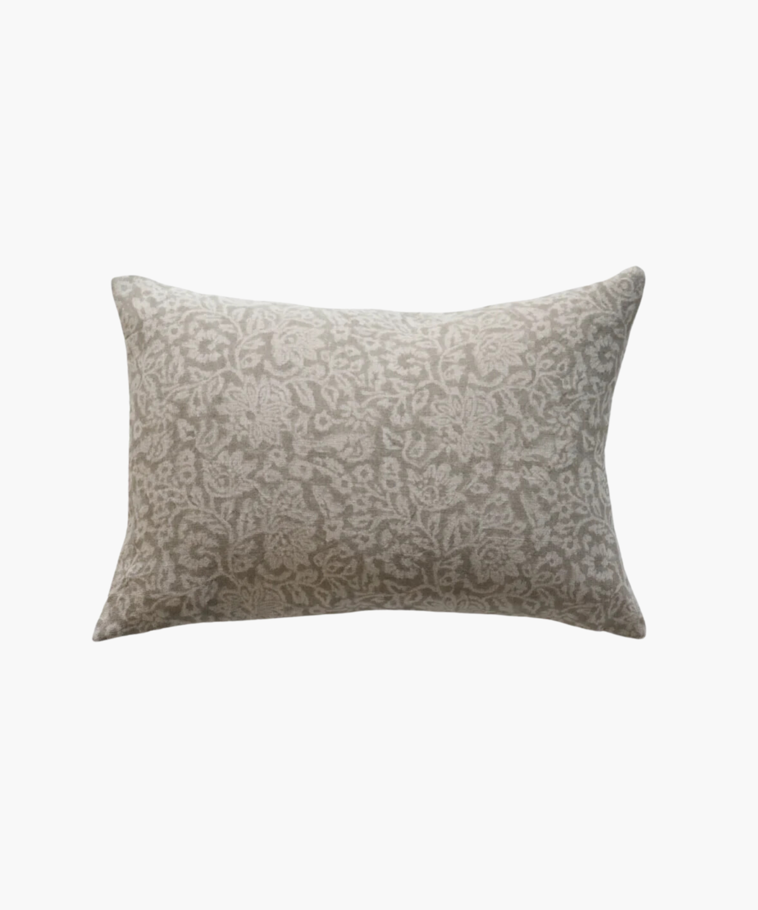 A beige rectangular lumbar pillow with a light gray, intricate floral pattern. The design is elegant, adding a soft, decorative touch suitable for a cozy setting. | Wildwood Home Co.

