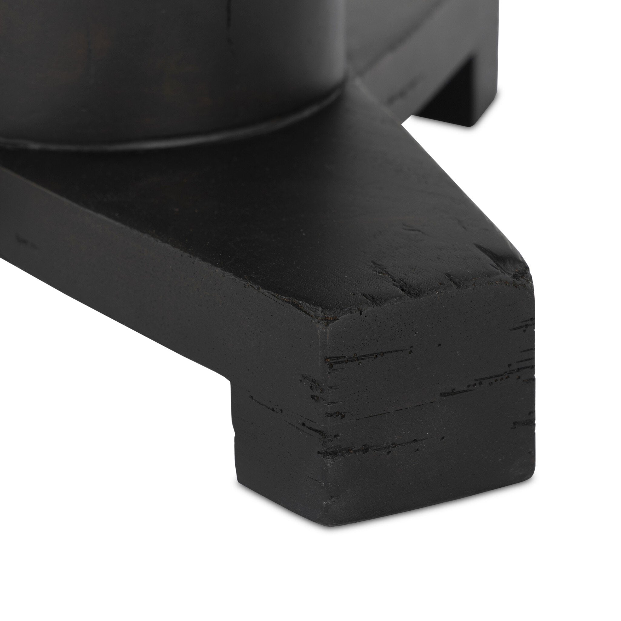 Close up of the a pedestal base with tripod feet on a white background.