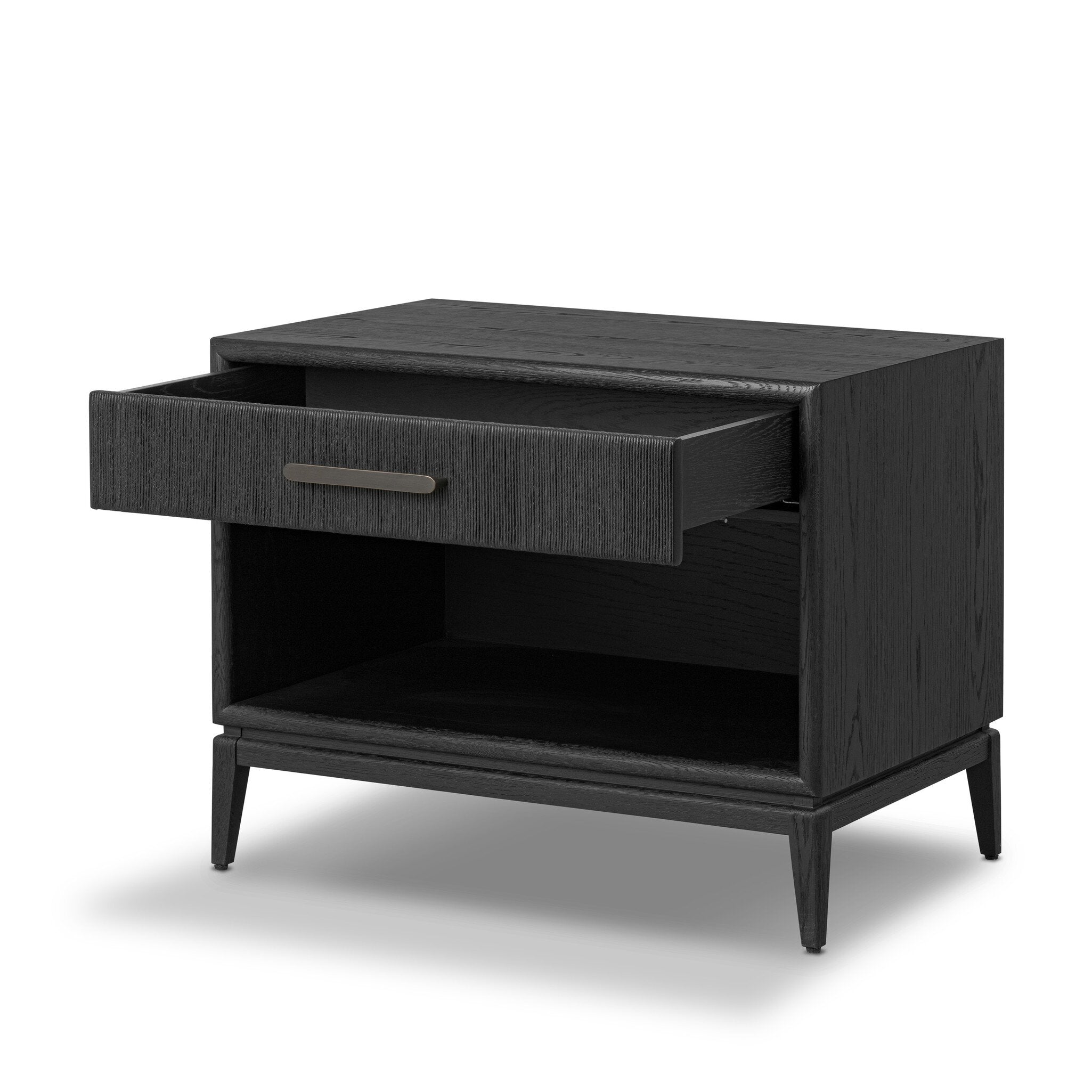 A black-finished oak nightstand with a smooth top and single drawer front of woven paper on a white background. 