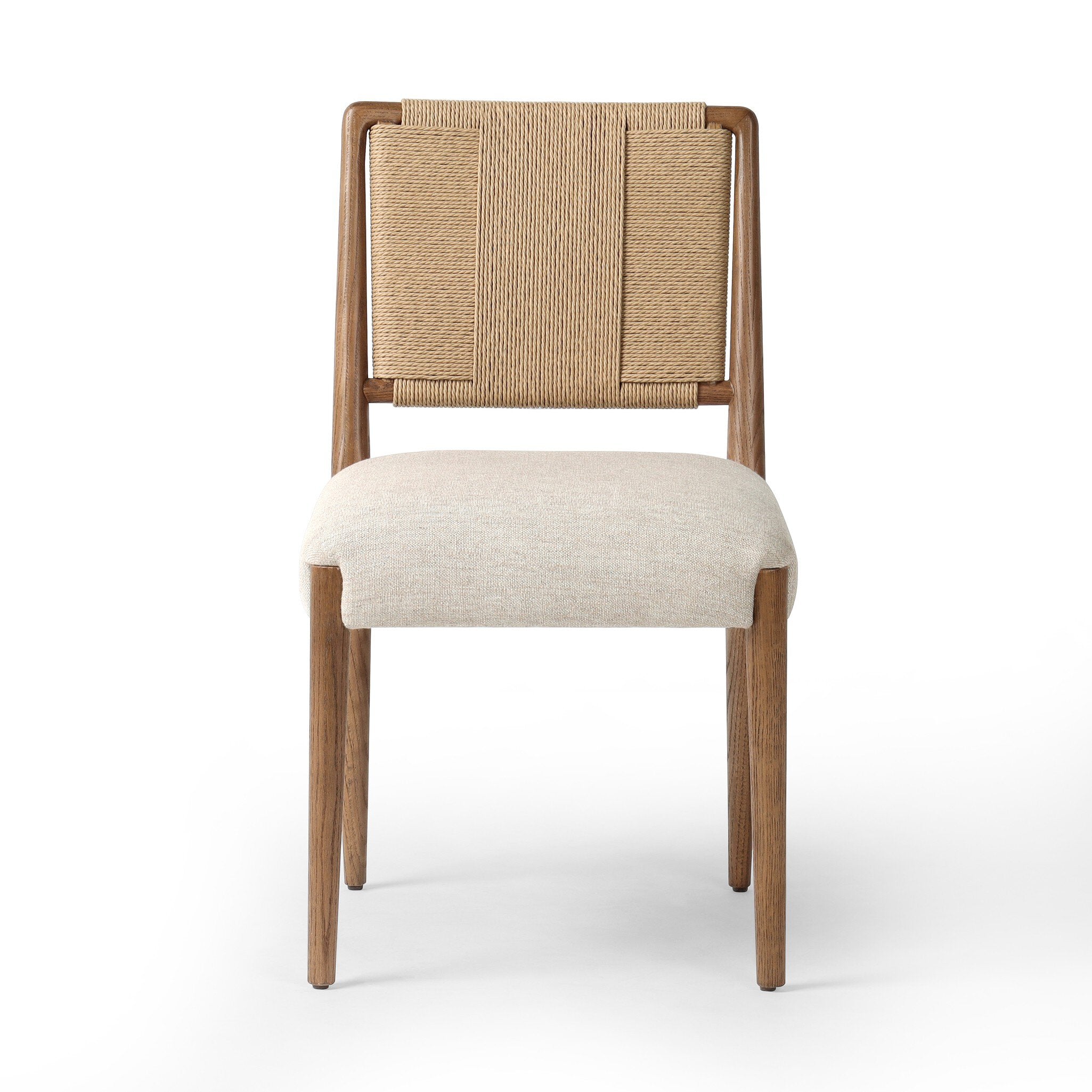 Dining chair with woven backrest and beige cushion on a white background. | Wildwood Home Co.