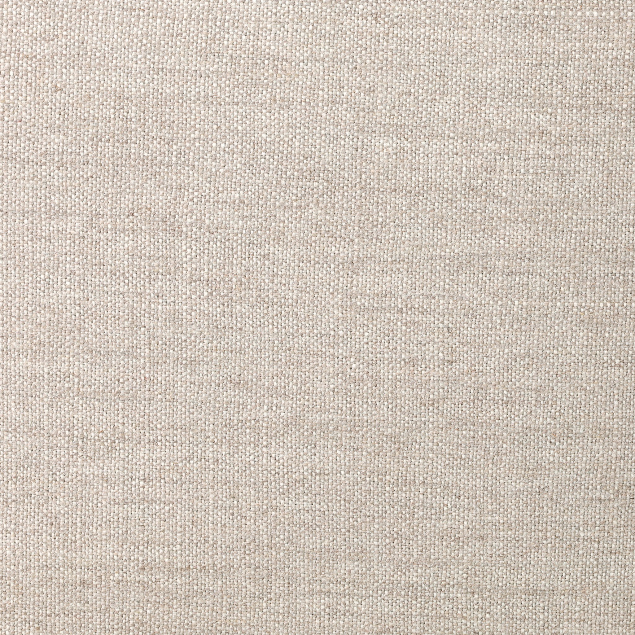 Close up of a dining chair with woven backrest and beige cushion on a white background.