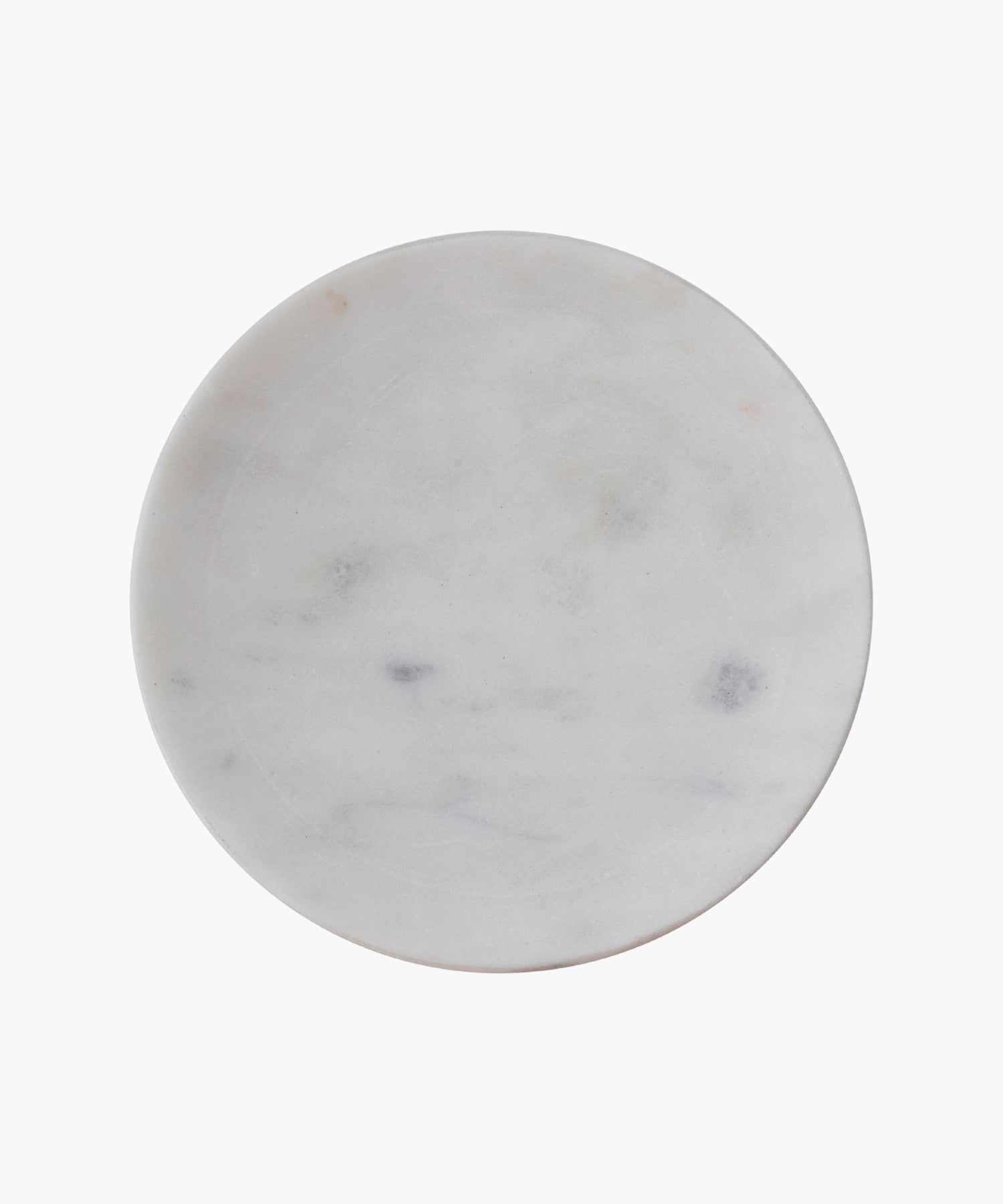 Overhead view of a round white marble soap dish with subtle gray veining. The smooth texture conveys simplicity and elegance. 
