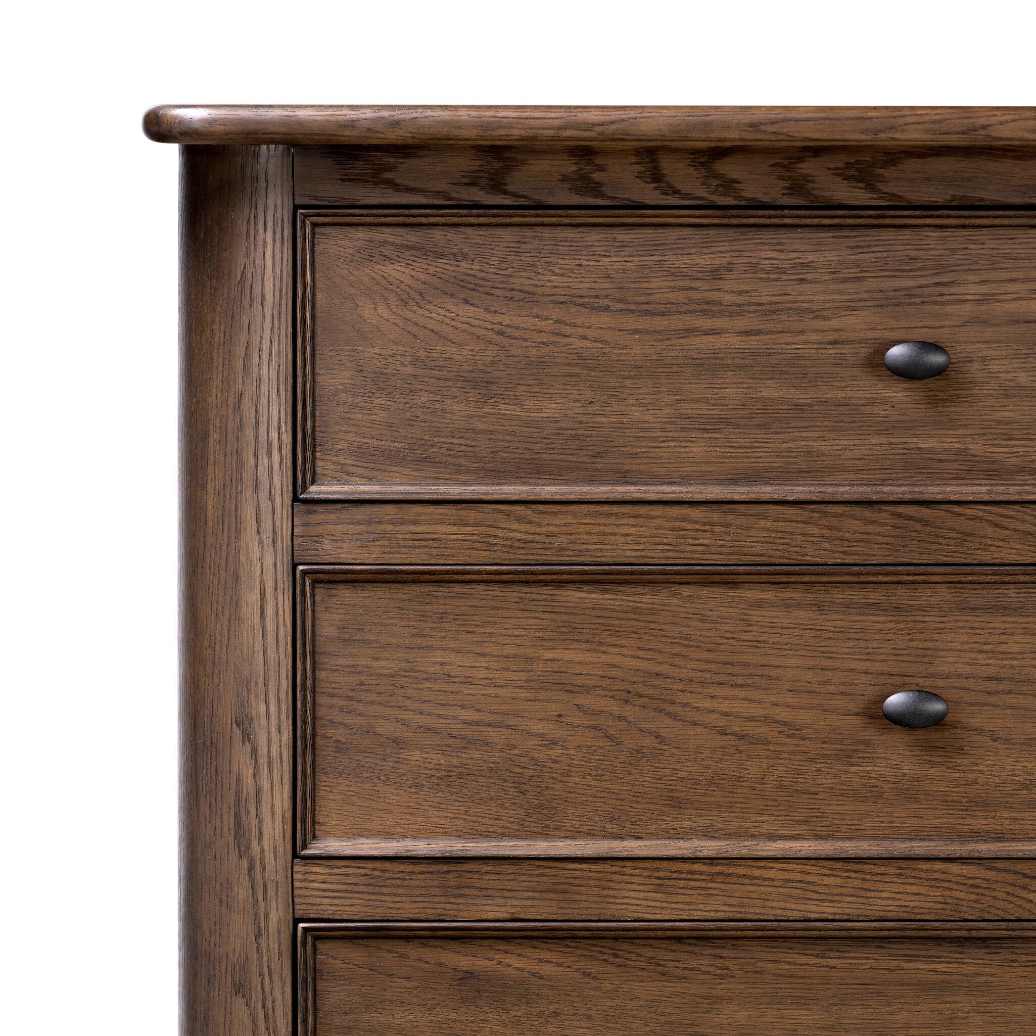 Close up of a wooden dresser with five drawers on a white background.