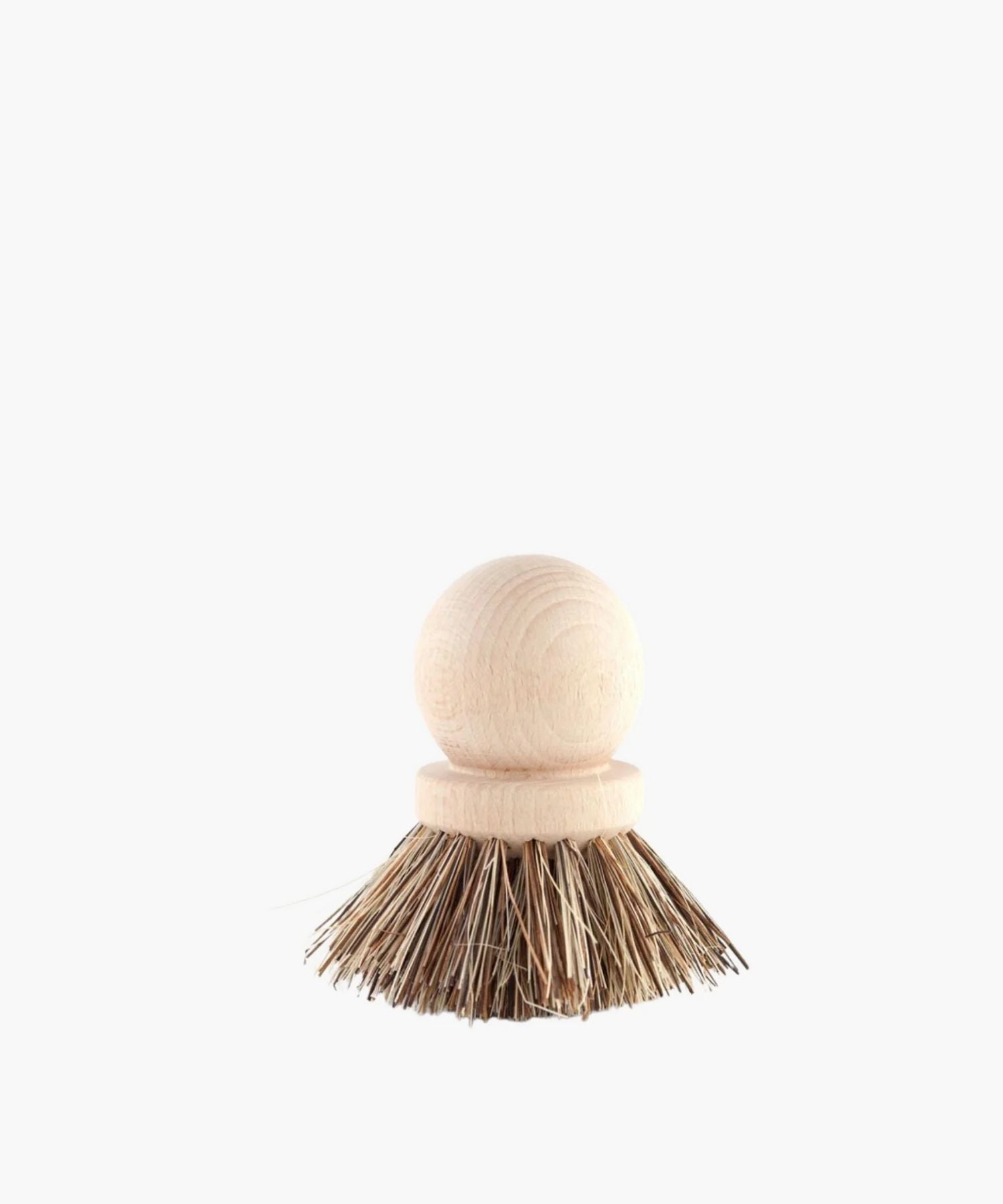 Wooden dish scrubber or saucepan brush with natural bristles, circular handle on top. Simple, eco-friendly cleaning tool with a minimalistic vibe. | Wildwood Home Co.