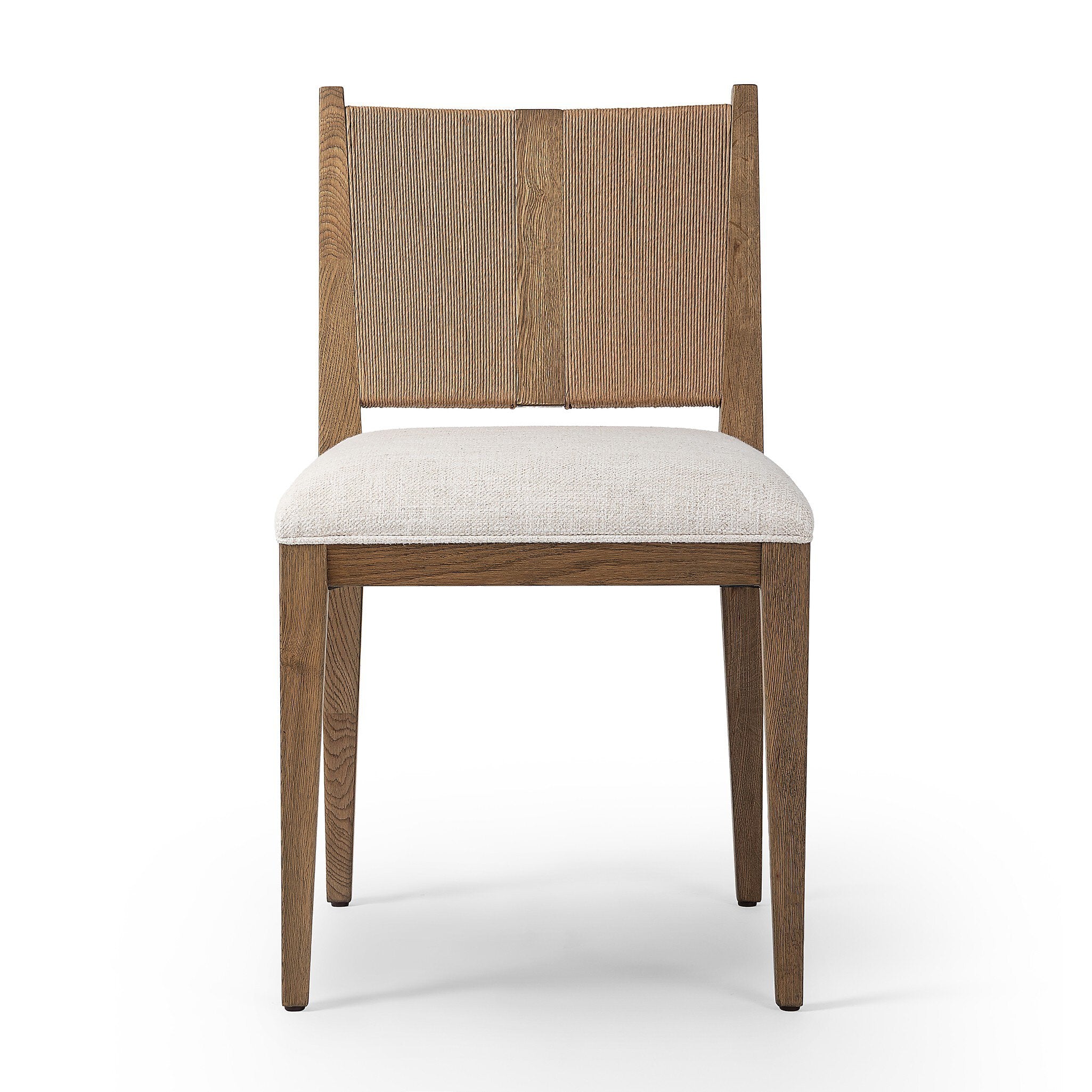 Wooden dining chair with a woven backrest and white cushion on a white background. | Wildwood Home Co.