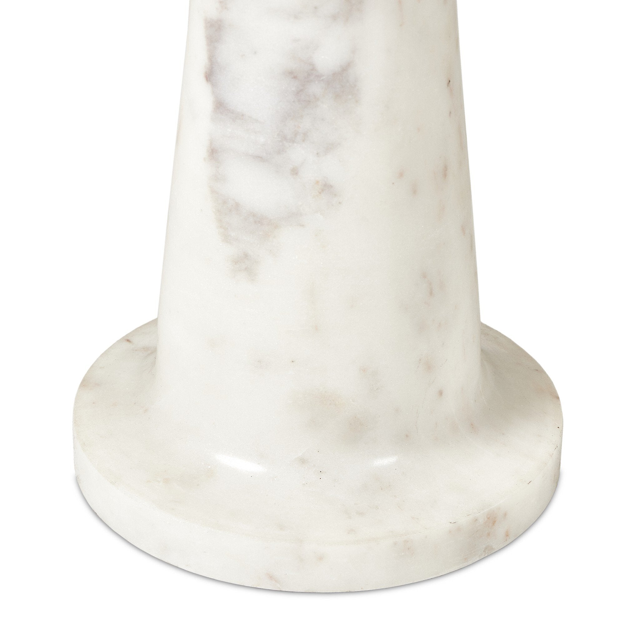 Close up of the white marble end table sculpted base on a white background.