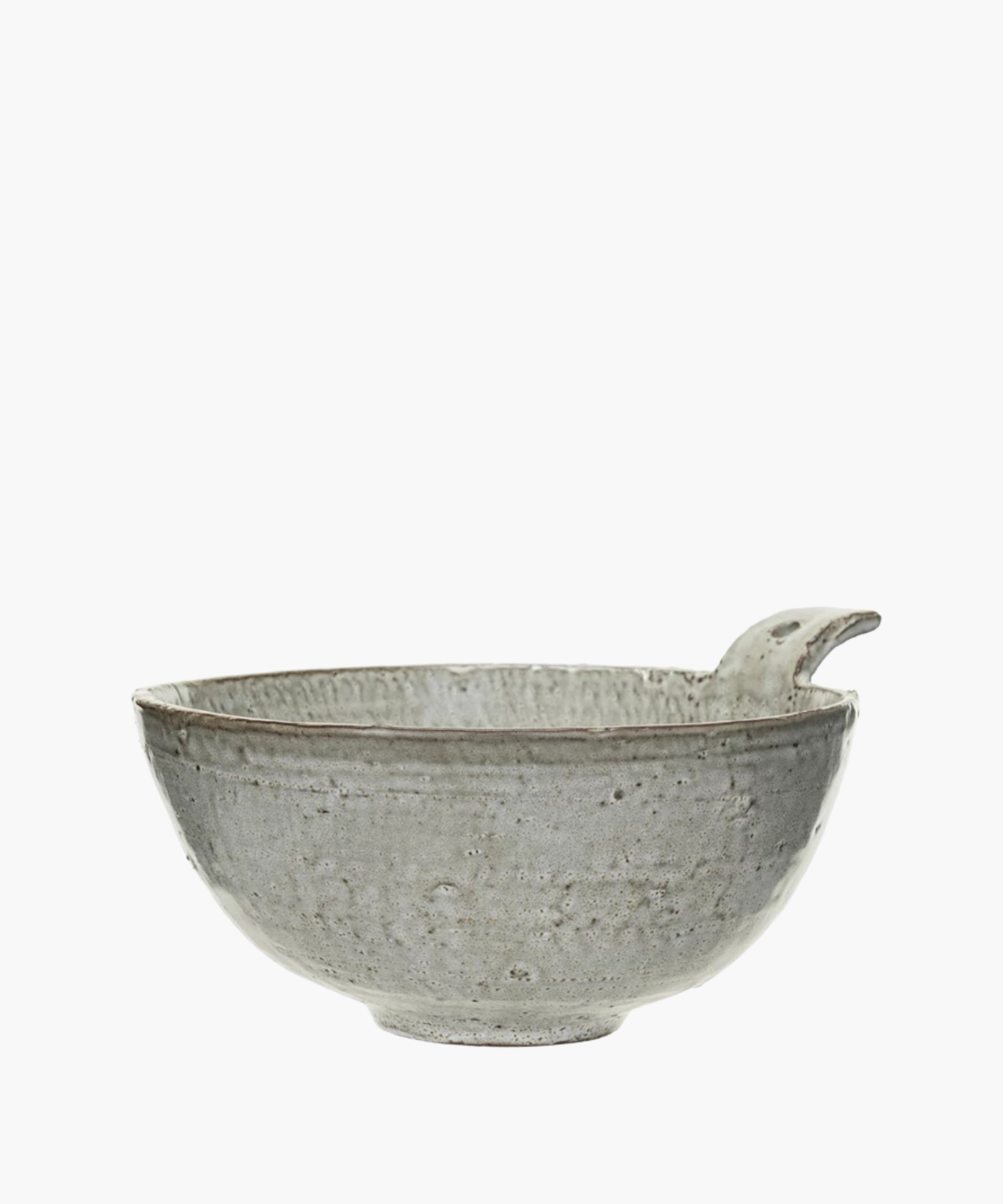 Rustic gray ceramic bowl with a textured surface and a unique spout handle. The design is minimalist, conveying a sense of simplicity and elegance. | Wildwood Home Co.