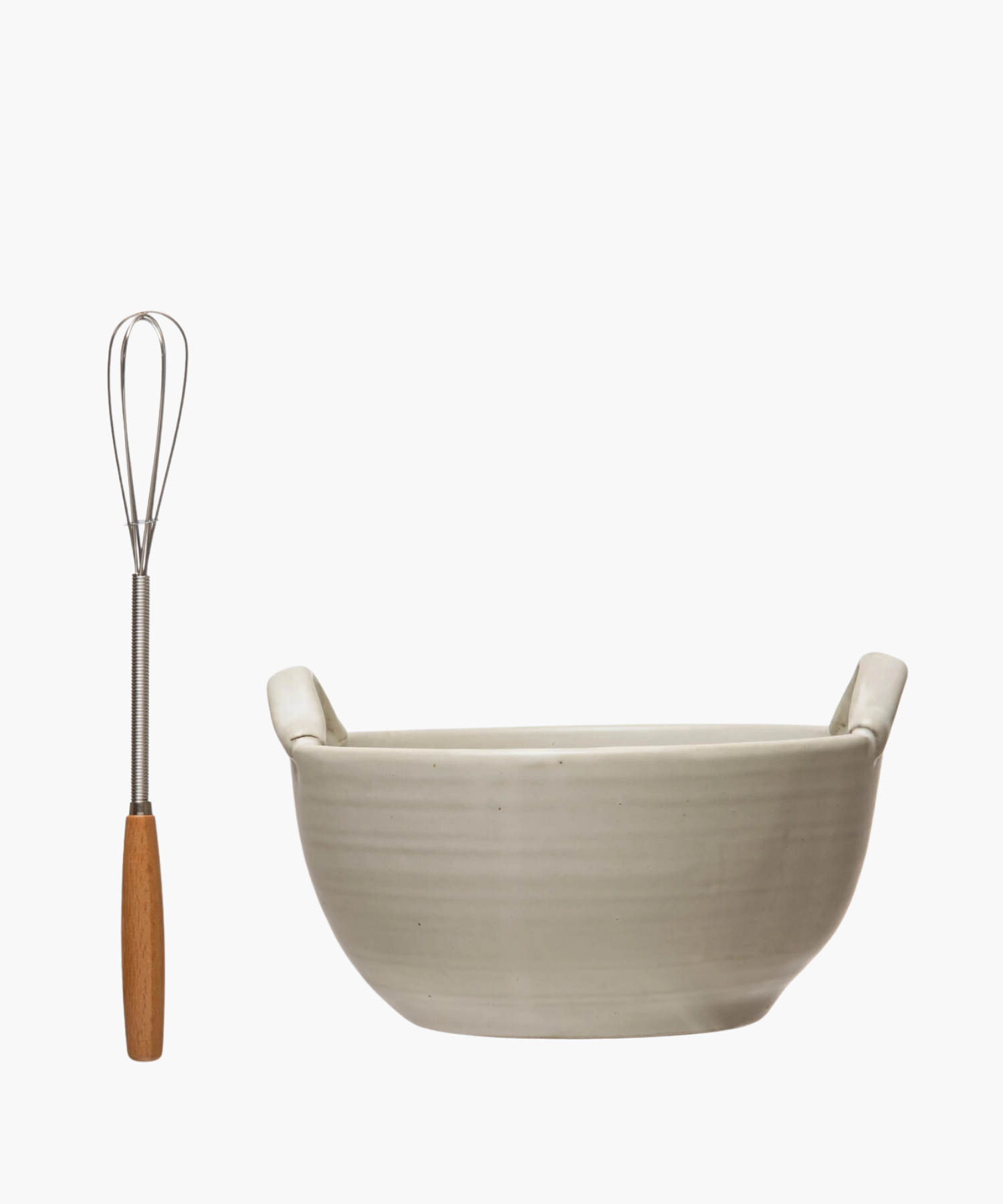 A cream colored stoneware ceramic mixing bowl with a metal whisk, evoking a clean, minimalist aesthetic. | Wildwood Home Co.