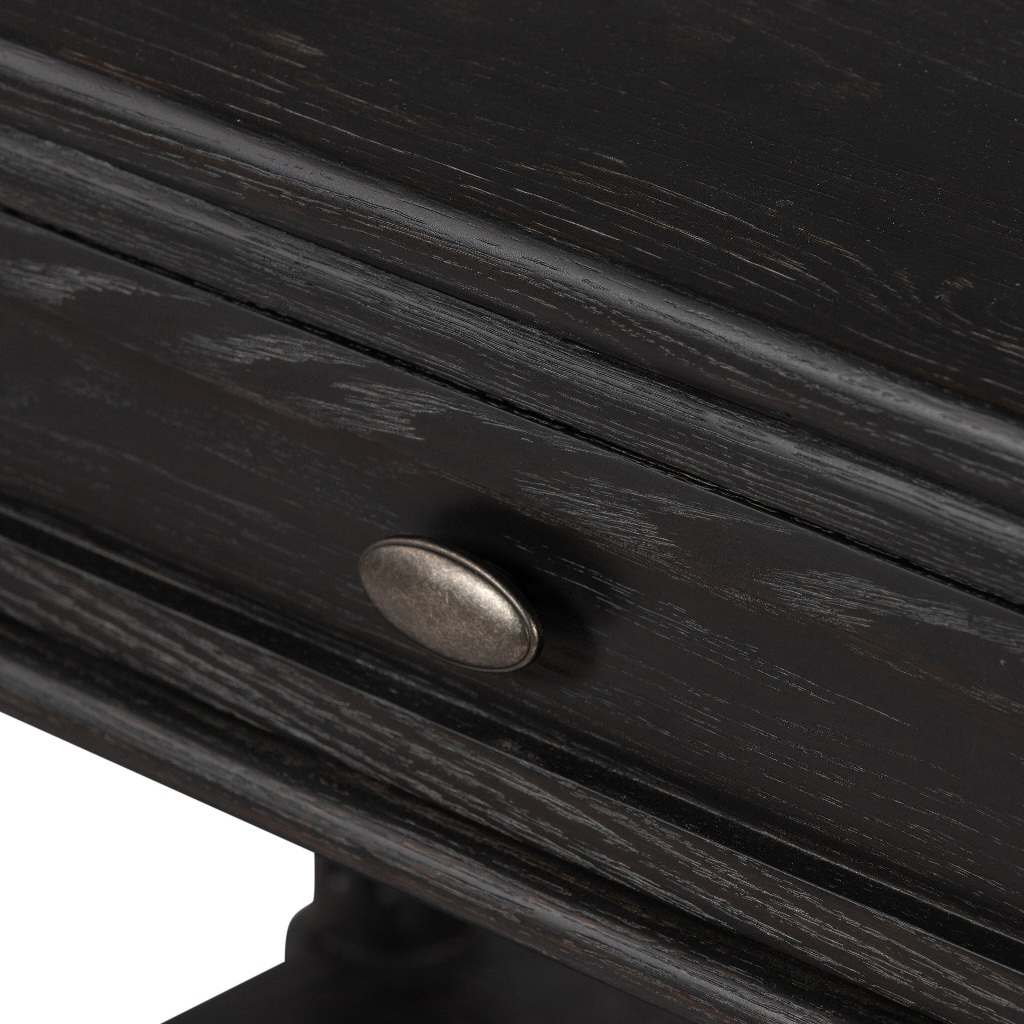 Close-up of a dark wooden drawer with a metal handle on a white background.