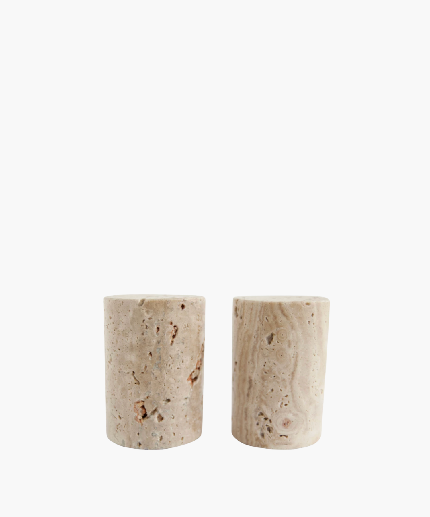 Travertine salt and pepper shakers with a speckled beige texture and natural marbling. The shakers have a minimalist and earthy design. | Wildwood Home Co.