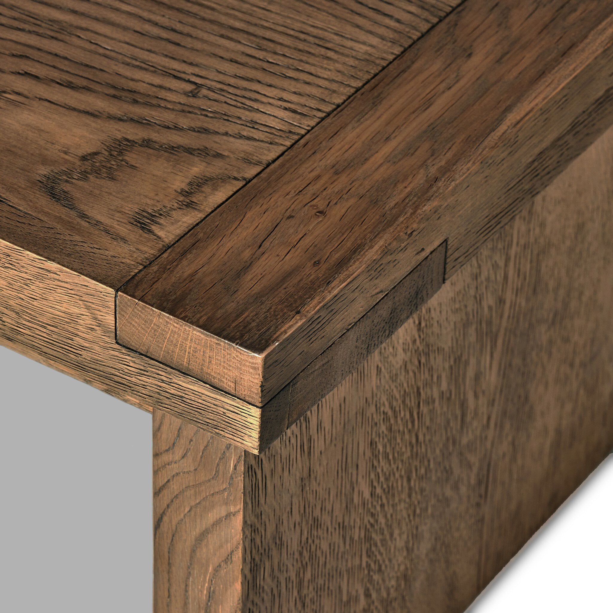 Close up of an oak coffee table on a white background.