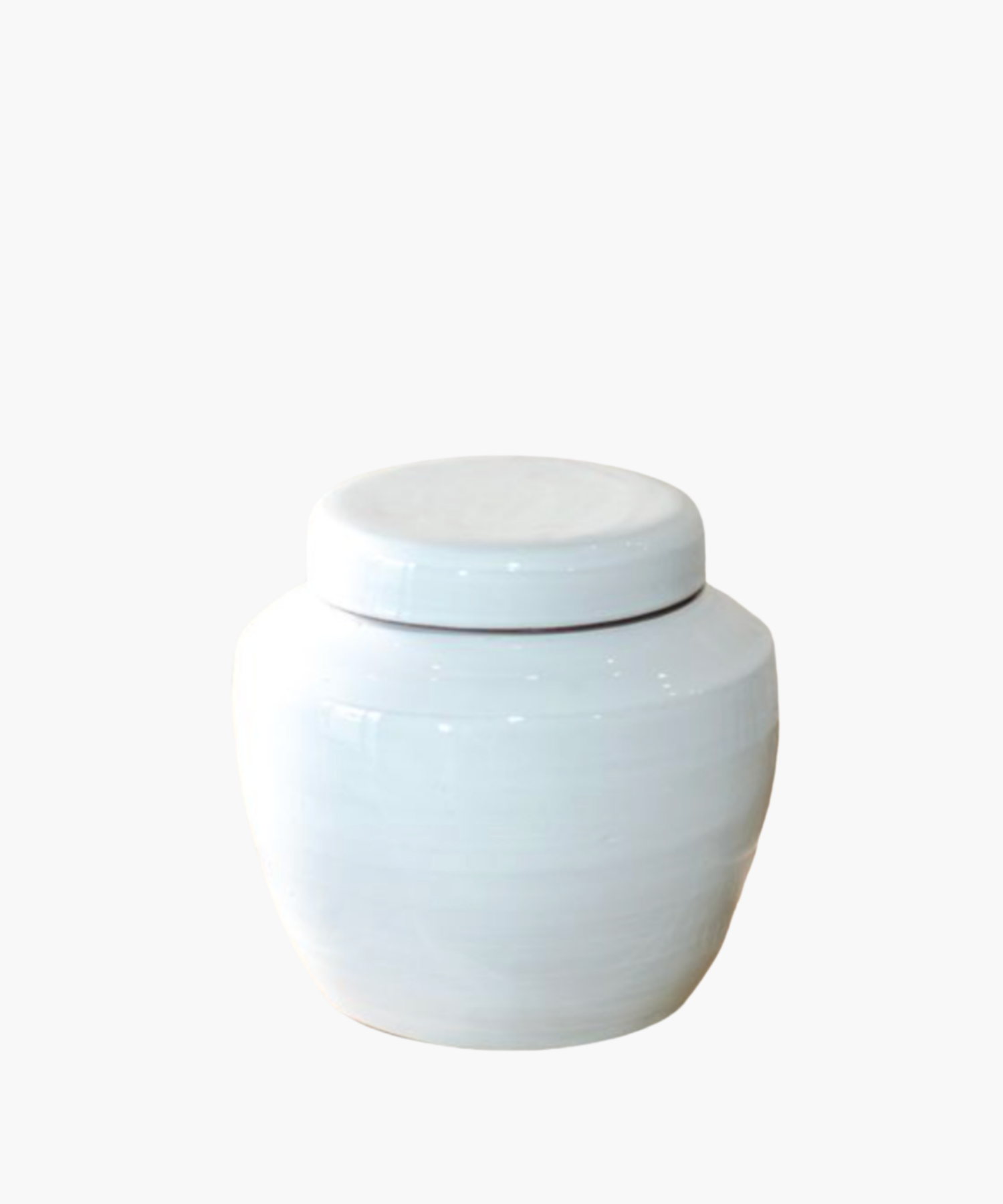 A glossy white ceramic jar with a fitted lid, displayed against a plain background. The surface reflects light, highlighting its smooth texture. | Wildwood Home Co.
