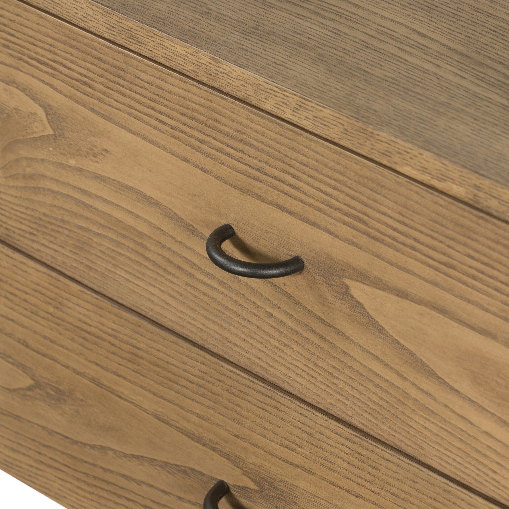 Close up of a wooden nightstand with two drawers and a woven shelf on a white background.