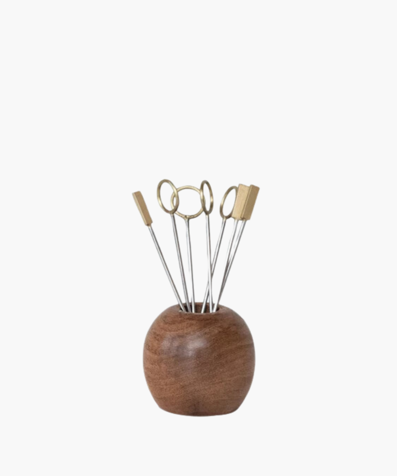 Wooden holder with metal skewers displaying round and rectangular brass tops. Modern, minimalist design conveys elegance and functionality. | Wildwood Home Co.