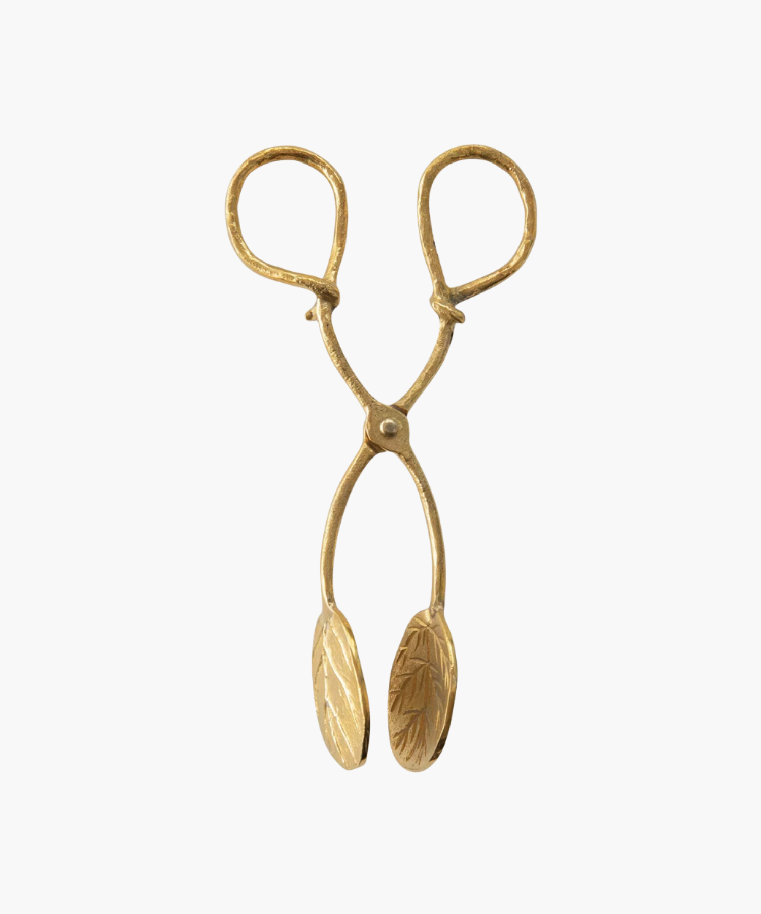 A pair of ornate, antique inspired gold tongs with detailed leaf engravings on the grips. The design conveys elegance and vintage charm. | Wildwood Home Co.