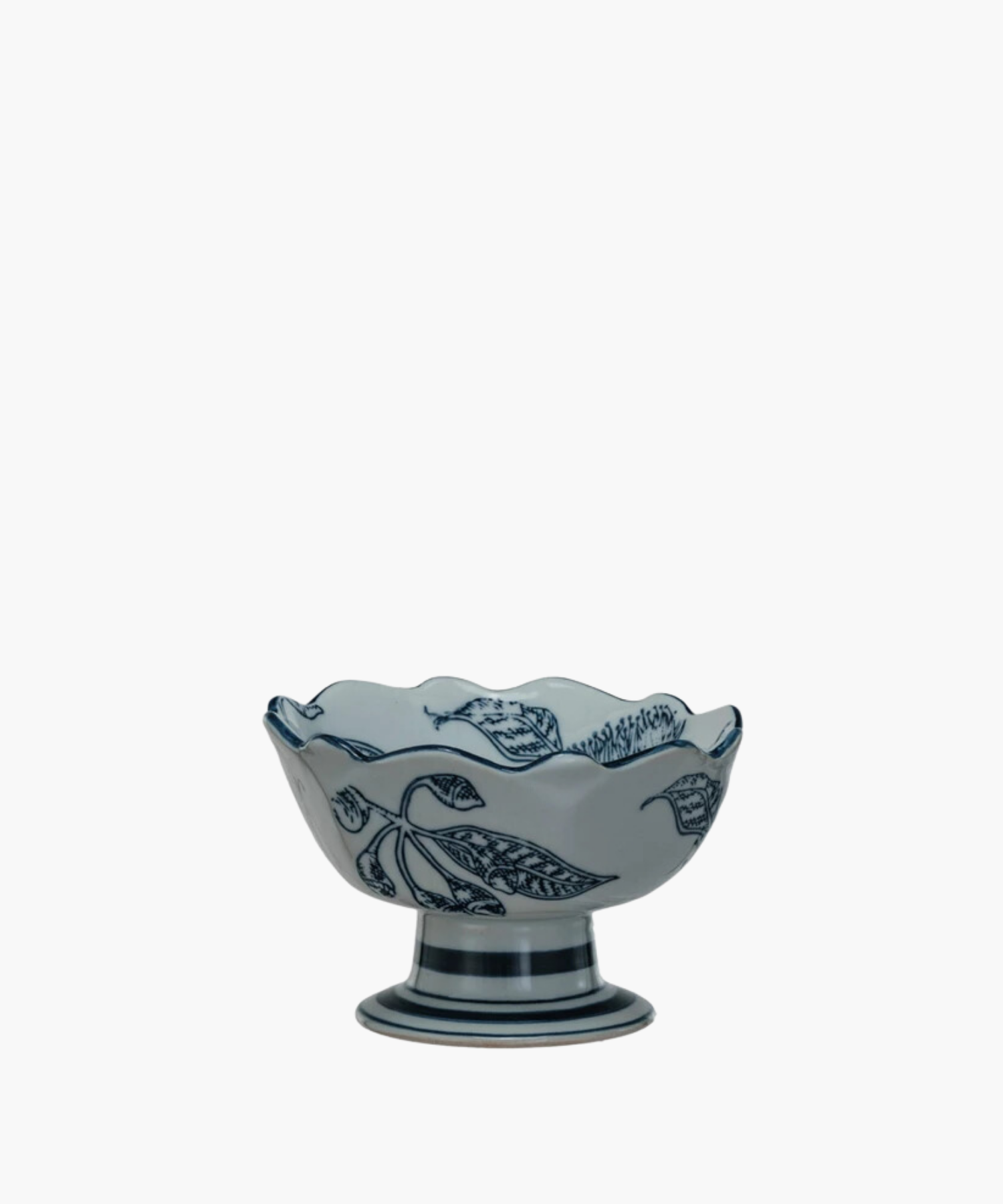 Elegant bowl with a wavy rim, decorated with intricate blue floral designs. The bowl rests on a sturdy pedestal base. | Wildwood Home Co.